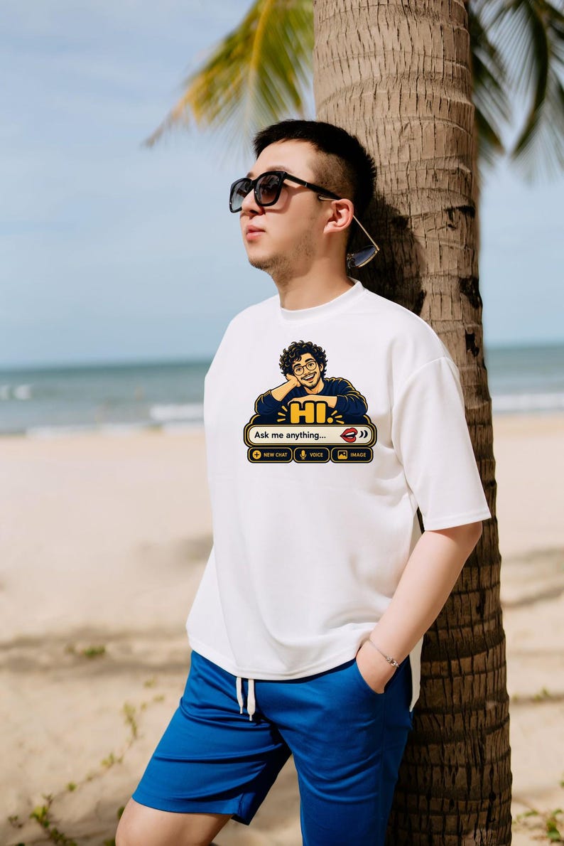 May include: A white short-sleeved t-shirt featuring a graphic print of a person with curly hair resting their head on their hand. Below the figure, a chat interface box displays the text HI, Ask me anything..., NEW CHAT, VOICE, and IMAGE.