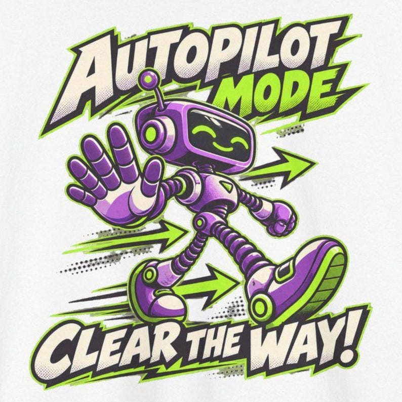May include: A graphic print featuring a purple robot with green accents, holding up a hand in a stop gesture. The text reads AUTOPILOT MODE at the top and CLEAR THE WAY! at the bottom, accompanied by green directional arrows on a white background.