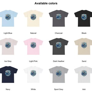 May include: A collection of twelve short-sleeve t-shirts in various colors including light blue, natural, charcoal, black, ice grey, light pink, dark heather, sand, navy, white, sport grey, and ash, each featuring a graphic with the text WATCH OUT! I'M ON AUTOPILOT NOW.
