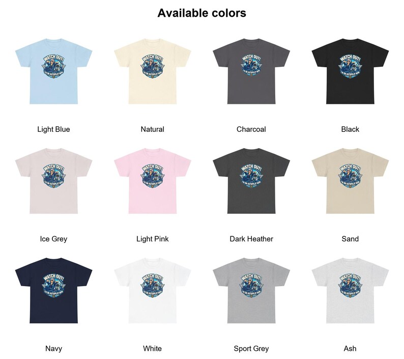 May include: A collection of twelve short-sleeve t-shirts in various colors including light blue, natural, charcoal, black, ice grey, light pink, dark heather, sand, navy, white, sport grey, and ash, each featuring a graphic with the text WATCH OUT! I'M ON AUTOPILOT NOW.