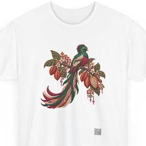 Resplendent quetzal shirt, Resplendent quetzal on a blooming cacao branch, front print of the t-shirt. A white t-shirt featuring a central graphic of a quetzal bird perched on a branch with cacao pods, green leaves, and white flowers.