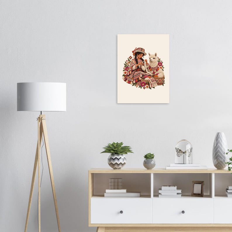 Andean spinner with alpaca and yarn baskets, folk art poster. A rectangular wall art print featuring an illustration of a person wearing a patterned hat and poncho, knitting with white yarn next to a white llama.