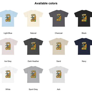 May include: A collection of eleven short-sleeve t-shirts in various colors including light blue, natural, charcoal, black, ice grey, dark heather, sand, navy, white, sport grey, and ash, each featuring a graphic of a person in a tree with the text I AM STUCK AS A TREE WHILE THEY GET TRILLIONS.