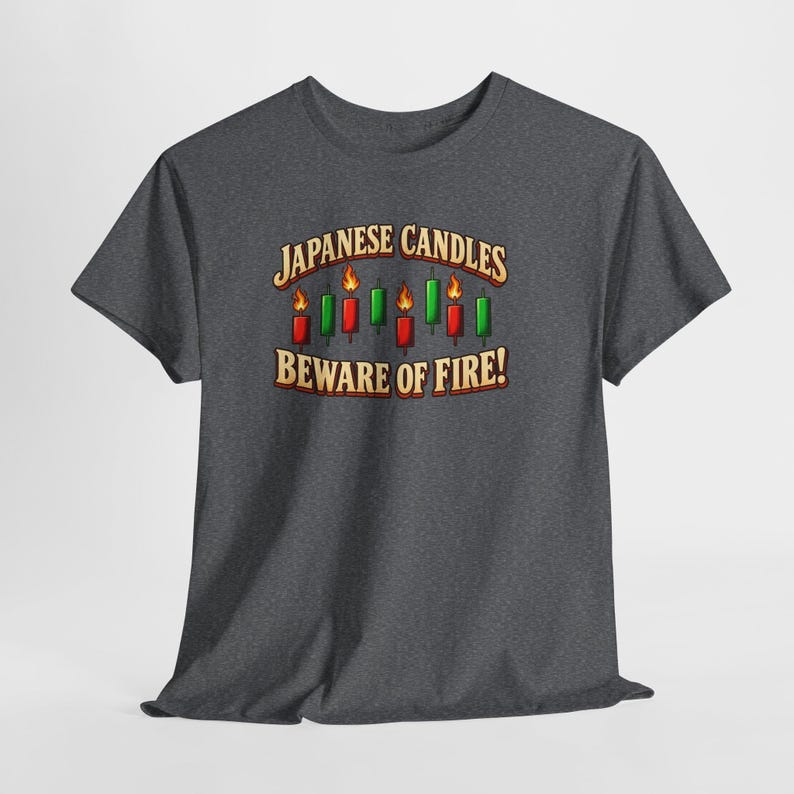 May include: A dark heather grey short-sleeve t-shirt featuring a graphic of red and green Japanese candlestick chart bars with flames. The text reads "JAPANESE CANDLES" above the bars and "BEWARE OF FIRE!" below in a bold, light-coloured font.