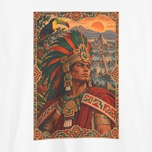 Aztec warrior t-shirt, Aztec warrior with a toucan before the temples and canals of Tenochtitlan, front print of the t-shirt. A white t-shirt featuring a graphic print of a person wearing a large, colourful feathered headdress and a red cloak.