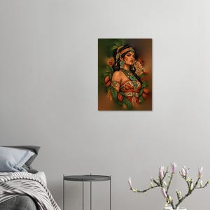 May include: A rectangular wall art print featuring a portrait of a person adorned in ornate turquoise jewelry, a feathered headdress, and patterned garments, surrounded by green leaves and orange cacao pods against a warm brown background.