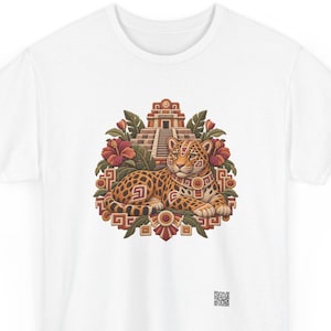 Jaguar t-shirt, Spotted jaguar resting before a stepped Maya pyramid with hibiscus flowers, front print of the t-shirt. A white t-shirt featuring a central graphic of a spotted jaguar resting in front of a stepped pyramid.