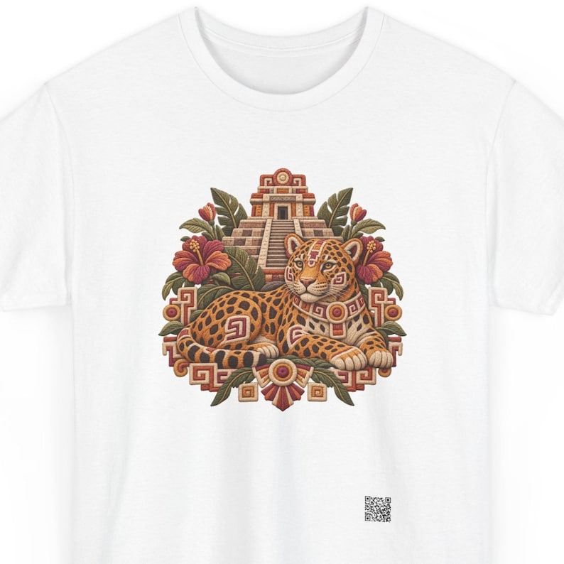 Jaguar t-shirt, Spotted jaguar resting before a stepped Maya pyramid with hibiscus flowers, front print of the t-shirt. A white t-shirt featuring a central graphic of a spotted jaguar resting in front of a stepped pyramid.