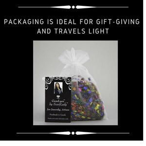 May include: A white organza bag with a colorful, patterned scarf inside. The bag is labeled with a business card that reads "GemLace by ScarfLady, Jan Jaworsky, Artisan, Handmade in Canada."