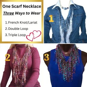 May include: One scarf necklace shown in three different ways to wear: French knot/Lariat, Double Loop, and Triple Loop. The scarf is a mix of blue, purple, and pink colors.