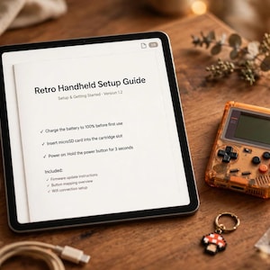 May include: A tablet displaying a Retro Handheld Setup Guide, a translucent orange handheld gaming console, a mushroom keychain, and a microSD card in a plastic bag. The guide text includes instructions to charge the battery and insert the card.