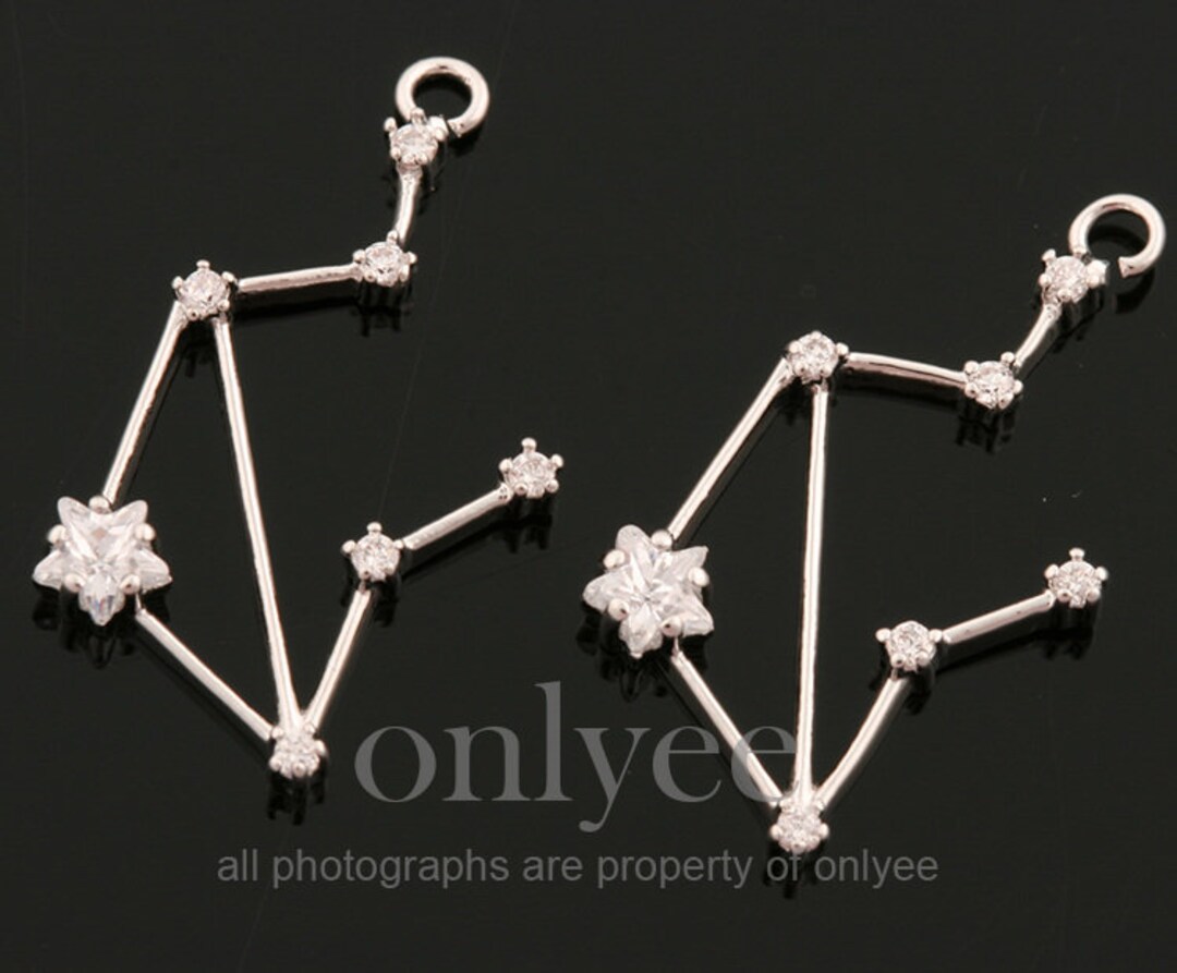 彫金レリーフ An inscribed gold and silver-inlaid bronze weight, Han