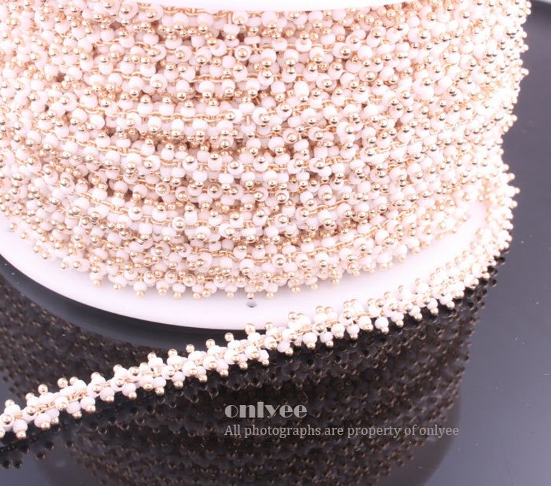 N121G 3FT - Chain Multe Lacy White Seed Glass Bead Gold Plated over Brass 7.6mm 1yd