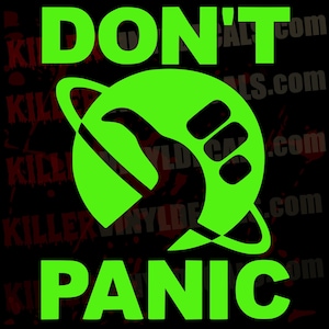 May include: A bright lime green vinyl decal featuring the text DON'T PANIC in bold capital letters. Centered between the text is a circular graphic of a planet with a ring and a stylized hand gesture showing a thumb pointing upward.