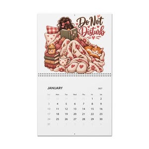 May include: A 2027 wall calendar for January featuring an illustration of a person reading a book while wrapped in a pink floral blanket with a cat, a candle, and a mug. The text Do Not Disturb is written in brown script above the illustration.