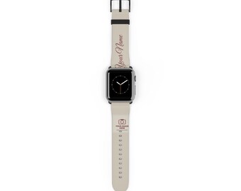 Może przedstawiać: Smartwatch z jasnobeżowym silikonowym paskiem i czarną klamrą. Na pasku widnieje napis Your Name ciemną czcionką oraz ikona aparatu nad tekstem YOUR IMAGE HERE. Tarcza zegarka jest czarna z białymi wskazówkami.