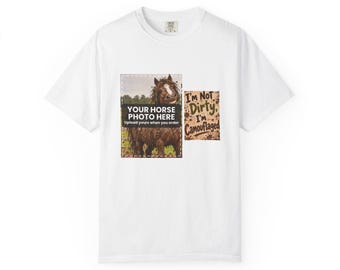 May include: A white short-sleeve t-shirt featuring a rectangular graphic with a horse photo placeholder and the text "YOUR HORSE PHOTO HERE" and "Upload yours when you order". Next to it is a brown sign with the text "I'm Not Dirty, I'm Camouflaged".