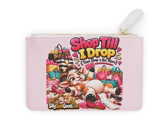 May include: A light pink rectangular zippered pouch featuring a cartoon goat lying amidst shopping bags, shoes, and accessories. The text reads Shop Till I Drop (Then Shop a Bit More) and SillyGoatGoods.com. The pouch has a white zipper pull.