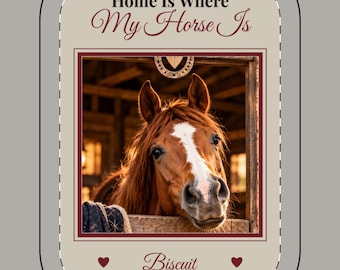 May include: A rectangular beige sign with a dashed border featuring the text Home Is Where My Horse Is at the top and the name Biscuit at the bottom with two small hearts. A central photograph shows a brown horse with a white blaze in a stable.