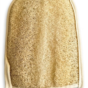 May include: A beige loofah bath mitt with a rounded top and a fibrous, porous texture. The mitt is constructed from natural plant fibres and features a light-coloured fabric trim along the curved edges to provide structure and durability.