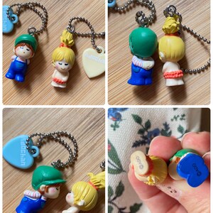 May include: A white ceramic mug with a black handle and the text "But First, Coffee" in a black, handwritten-style font. The mug is on a white surface.