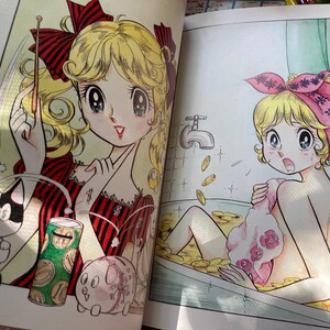 May include: A colorful manga illustration depicts a young woman with blonde hair, red bows, and a red and black striped dress. A cat with a dollar sign on its eye and a piggy bank are also shown. The second image shows a woman in a bathtub filled with coins.