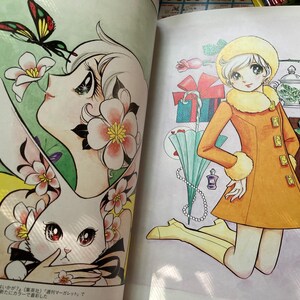 May include: A colorful illustration from a book featuring a woman with flowers and a rabbit, and a girl in an orange coat. The girl is kneeling next to a chocolate bar, gifts, and a teapot. The illustration is in a manga style.