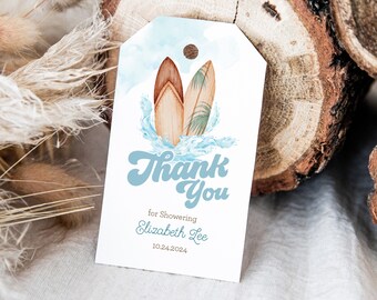 May include: A blue and white thank you tag with a watercolor illustration of two surfboards with palm trees. The text reads "Thank You for Showering Elizabeth Lee 10.24.2024".