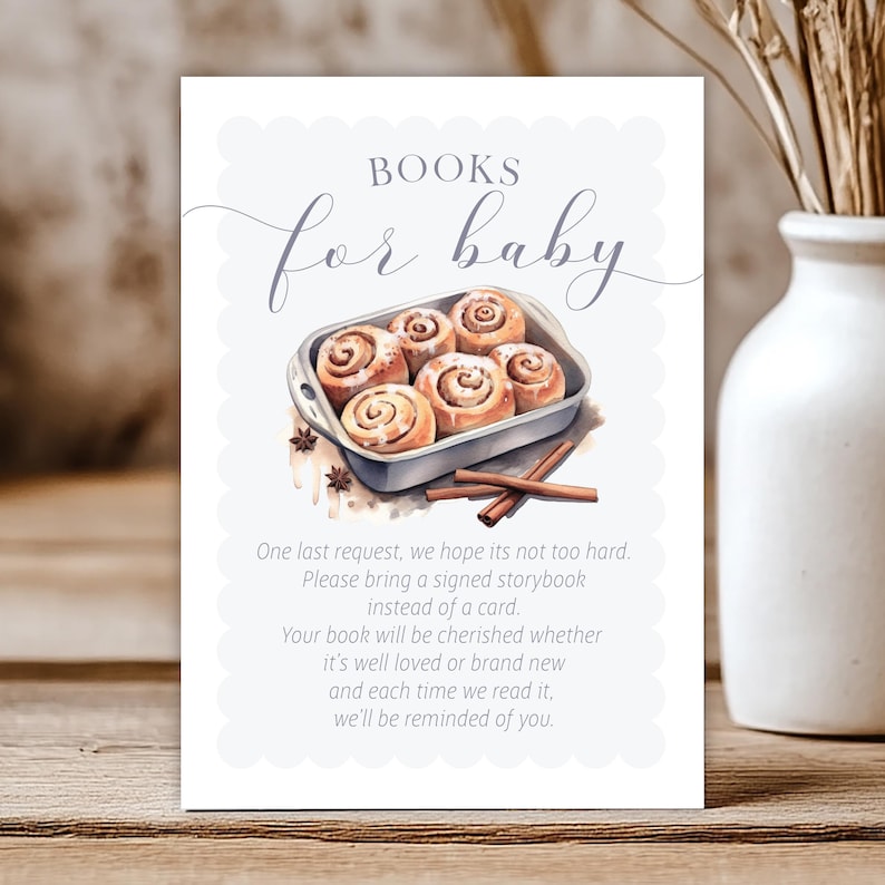 Może przedstawiać: Jasnoniebieski znak na baby shower z napisem "BOOKS for baby" w eleganckiej czcionce. Znak zawiera akwarelową ilustrację bułek cynamonowych w brytfannie, z tekstem proszącym o podpisaną książeczkę zamiast kartki.