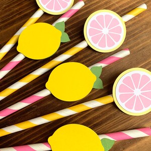 May include: Set of six yellow and pink paper straws with lemon and lime cutouts. The straws have pink and yellow stripes.