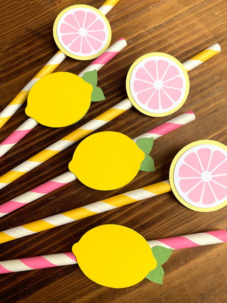 May include: Set of six yellow and pink paper straws with lemon and lime cutouts. The straws have pink and yellow stripes.