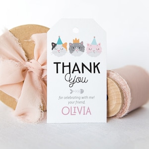 May include: White thank you tag with three cartoon cats wearing party hats. The text reads "Thank You for celebrating with me! Your friend, Olivia."