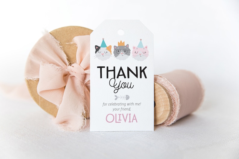 May include: White thank you tag with three cartoon cats wearing party hats. The text reads "Thank You for celebrating with me! Your friend, Olivia."