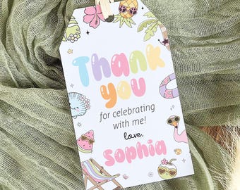 May include: A white gift tag with a tropical theme. The tag features the words "Thank You" in colorful bubble letters, along with the text "for celebrating with me! love, Sophia." Decorative illustrations include a pineapple, palm tree, and a flamingo.
