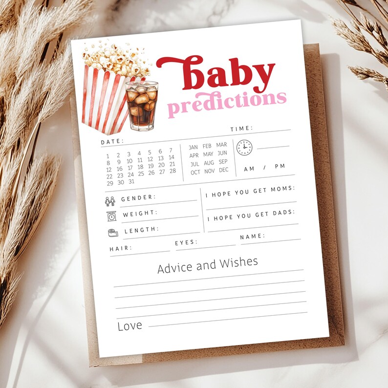 May include: A baby predictions card with a popcorn and soda graphic. The card has sections for date, time, gender, weight, length, hair, eyes, and name. It also includes space for advice and wishes.