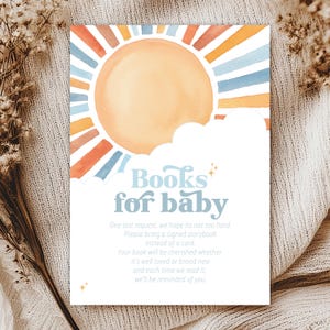 May include: A watercolor illustration of a sun with rainbow stripes and a cloud with the text "Books for baby". The text below the illustration reads "One last request, we hope it's not too hard. Please bring a signed storybook instead of a card. Your book will be cherished whether it's well loved or brand new and each time we read it, we'll be reminded of you."