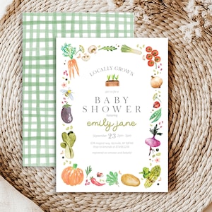 May include: A white baby shower invitation with a green and white gingham pattern in the background. The invitation features a watercolor illustration of a variety of vegetables and herbs, with the text "Locally Grown" and "Baby Shower" in a green font. The invitation is for a baby shower honoring Emily Jane on September 23rd from 2pm to 5pm.