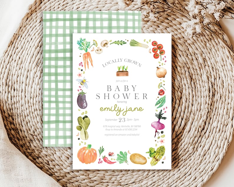 May include: A white baby shower invitation with a green and white gingham pattern in the background. The invitation features a watercolor illustration of a variety of vegetables and herbs, with the text "Locally Grown" and "Baby Shower" in a green font. The invitation is for a baby shower honoring Emily Jane on September 23rd from 2pm to 5pm.