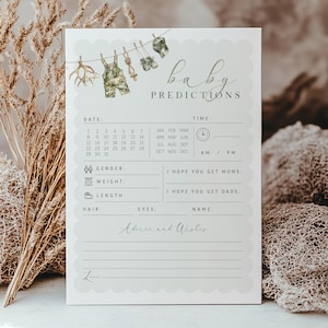 May include: A baby shower prediction card with a scalloped edge. The top features a clothesline with baby clothes and the words "baby predictions." The card includes sections for date, time, gender, weight, length, hair, eyes, and name.