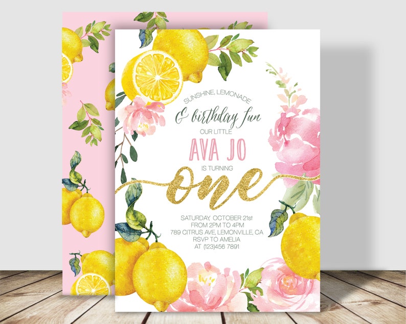 May include: A lemon-themed first birthday party invitation with pink and yellow watercolor flowers, lemons, and greenery. The text reads "Sunshine Lemonade & birthday fun, Our Little Ava Jo is turning one, Saturday October 21st from 2pm to 4pm, 789 Citrus Ave, Lemonville, CA, RSVP to Amelia at (123)456 7891".