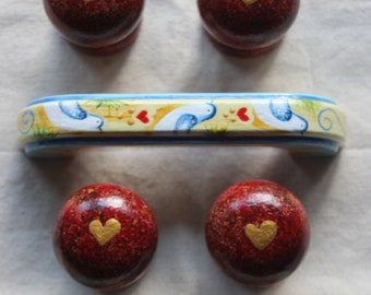 red heart knobs and bird and red heart D handles, painted handles and knobs, red and gold knobs, gold heart knob, painted bird handles pulls