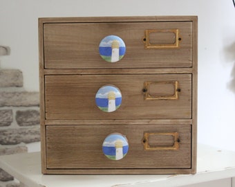 Wood Drawers With Light House Painted Knobs.