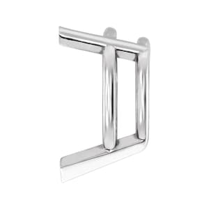 May include: A polished silver-toned metal ring featuring a double-band design. The structure consists of two parallel vertical bars connected by two horizontal bars at the top and bottom, creating a geometric, open-frame appearance with a smooth finish.