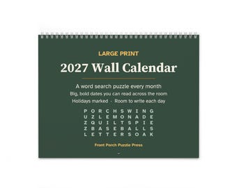 May include: A dark green 2027 wall calendar with white text and a silver spiral binding. The cover features the text LARGE PRINT 2027 Wall Calendar, a word search puzzle, and the brand name Front Porch Puzzle Press at the bottom.