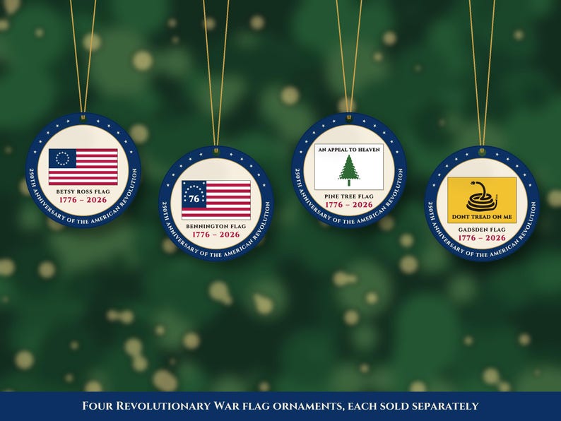 May include: Four round ornaments featuring historical American flags: the Betsy Ross flag, Bennington flag, Pine Tree flag, and Gadsden flag. Each ornament displays the text 250th Anniversary of the American Revolution and 1776-2026.