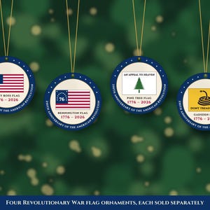 May include: Four round ornaments featuring historical American flags: the Betsy Ross flag, Bennington flag, Pine Tree flag, and Gadsden flag. Each ornament displays the text 250th Anniversary of the American Revolution and 1776-2026.