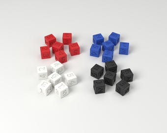 May include: A collection of twenty-four small, cube-shaped dice arranged in four distinct color groups of red, blue, white, and black. Each cube features embossed numbers on its faces, with the sets organized into clusters of six cubes each.