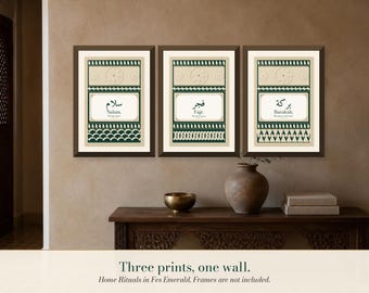 May include: A set of three rectangular wall art prints featuring dark green and cream geometric patterns. Each print displays Arabic calligraphy and English text: Salam, Fajr, and Barakah. The prints are enclosed in dark brown frames.