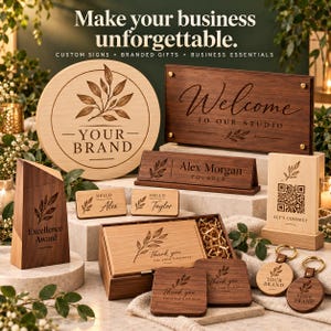 May include: A collection of custom wooden business items including a round sign, a rectangular wall sign reading Welcome To Our Studio, a desk nameplate for Alex Morgan, two name tags, a QR code sign, a box, coasters, and keychains.