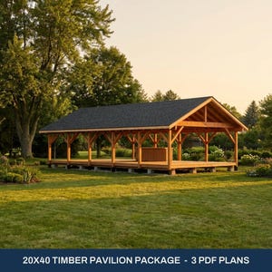 May include: A 20x40 timber pavilion structure featuring a dark shingled gable roof, exposed wooden beams, and support posts set on concrete blocks. The open-air design includes a wooden platform base and a small wooden counter.